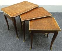A nest of three gilt metal mounted kingwood parquetry tables
