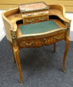 A bonheur du jour in parquetry and ormolu decorated kingwood, shaped with concave sides, furnished