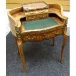 A bonheur du jour in parquetry and ormolu decorated kingwood, shaped with concave sides, furnished