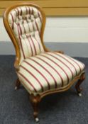 A walnut framed spoon-back chair with striped upholstery, circa 1890