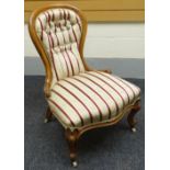 A walnut framed spoon-back chair with striped upholstery, circa 1890