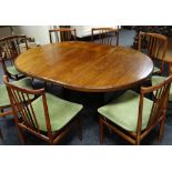 A Danish rosewood circular dining table on centre four-spoked pedestal, 119cms, extending with two