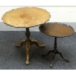 A faded-mahogany tilt-top galleried table with scrolling bordered top upon tripod supports with