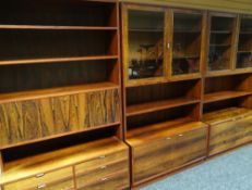 A Danish rosewood three-piece modular furniture set, comprising pair of semi-glazed bookcases with