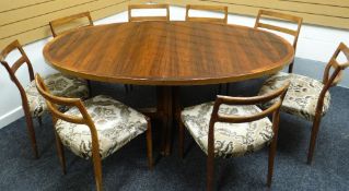 A Danish rosewood extending oval dining table and eight matching chairs by Rosengaarden, circa