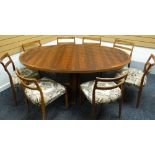 A Danish rosewood extending oval dining table and eight matching chairs by Rosengaarden, circa