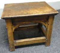 An exceptionally heavy small English joined-oak table with rectangular top and carved shaped aprons,