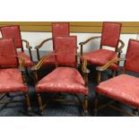 A set of six mahogany elbow chairs with curved arms, tapering upholstered seats and upholstered