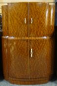 A polished mahogany two stage cocktail-cabinet of shaped form, circa 1925,  36ins wide (92cms)