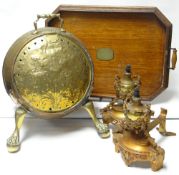 A wooden galleried tray, pair of ornate fire-dogs and a brass cylinder coal box with copper