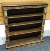 An English oak carved open bookcase of five shelves, 115cms, circa 1910s