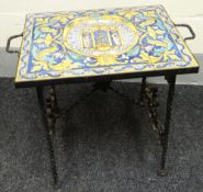 A small table, the top in the form of twelve Majolica tiles conjoining to depict a central religious