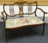 An inlaid mahogany Sheraton-style settee, with floral tapestry seat, circa 1910, 43ins wide (109cms)