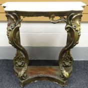 A gilt-wood and gesso console table in the Rococo style with shell and acanthus decoration to the