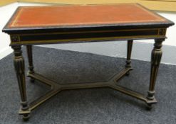 An ebonised and gilt leather top library table with angular stretcher and acanthus carved
