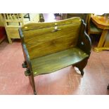 A neat 20th Century hall bench with peg jointed seat and sides and simple heart decoration, 95 cms