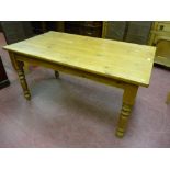 A Victorian style pine kitchen table on turned legs, 78 cms high, 153 cms long, 85 cms wide