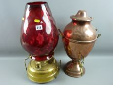 A copper and brass samovar and a large brass based oil lamp, electrically converted with a deep