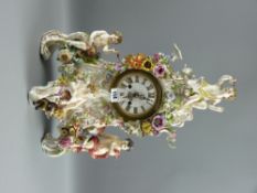 A large Meissen cherubic and floral encased mantel clock, 47 cms high, 32 cms wide