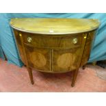 An early 20th Century bow front mahogany sideboard having single central drawer with brass ring