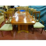A good quality modern light oak and walnut effect extending dining table with additional leaf
