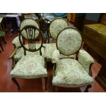 An early 20th Century drawing room suite of two seater couch and two elbow chairs, all with shield