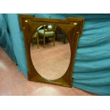 Edwardian mahogany crossbanded oval centred wall mirror with shaped edge decoration, 70 x 100.5 cms
