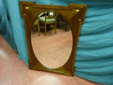Edwardian mahogany crossbanded oval centred wall mirror with shaped edge decoration, 70 x 100.5 cms