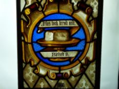 An early Victorian stained and painted glass panel showing a scroll edged cartouche with central