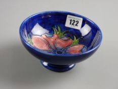 A Moorcroft pottery blue ground 'Anemone' oval footed bowl, 14.5 cms diam