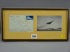 A framed collector's item containing a stamp addressed envelope and the photograph from within of