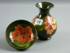 A Moorcroft pottery green ground 'Hibiscus' small bowl, 11.5 cms diam and a bulbous vase with