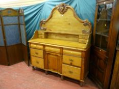 A Victorian pine and mahogany chiffonier with carved four drawer gallery back, the base with three