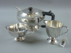 A three piece silver tea service, each piece to a circular pedestal base and of square form with