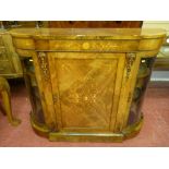 A Victorian walnut and inlaid breakfront credenza having a centre cupboard with large scrolled
