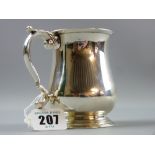 A silver pedestal tankard of waisted form with scrolled handle, 6.2 ozs, Chester, possibly 1912