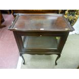 A reproduction walnut tray top drink's cabinet, glass panel sided with drop down door over a