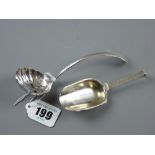 A silver sugar castor with attractive pierced and floral bowl and graduated curved handle, 0.7