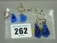 Two pairs of white metal and blue stone earrings