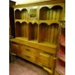 A late 19th/early 20th Century solid oak Art Nouveau dresser sideboard, six section rack with
