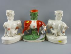 A colourful Staffordshire pottery cow before a stream spillholder with a pair of white and lustre