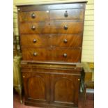 A Victorian mahogany chest of three long and two short drawers with turned wooden knobs for