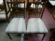 A pair of late 19th Century rosewood chairs with boxwood string decoration and inlaid backs with