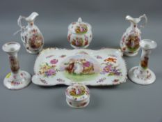 A Victorian pottery seven piece dressing table set, transfer decorated with Kaufmann panels of