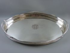 A good sized electroplate two handled serving tray with pierced gallery and folded rim, 63 x 42