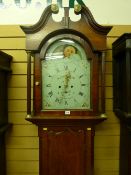 An early 19th Century oak and mahogany longcase clock, the hood with broken swan neck pediment,