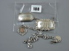 A whisky label, Birmingham 1964; a sherry label, Birmingham 1930; a pendant fob, Birmingham 1916