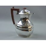 A silver coffeepot of oval form with step and lined decoration, 20 ozs gross, Birmingham 1931
