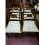 A set of six (four plus two) Regency style dining chairs with twist carved top rail, centre back