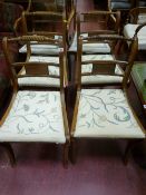 A set of six (four plus two) Regency style dining chairs with twist carved top rail, centre back